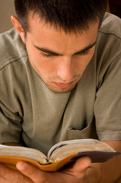 istock Young Man Reading the Bible 173931166