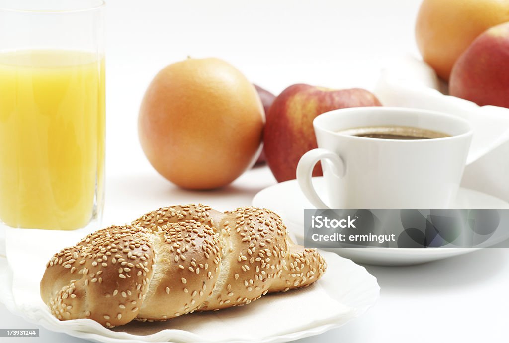 Sesame roll, coffee, juice and fruits for breakfast "Sesame roll, coffee, juice and fruits for breakfast.Other similar images:" Baked Stock Photo