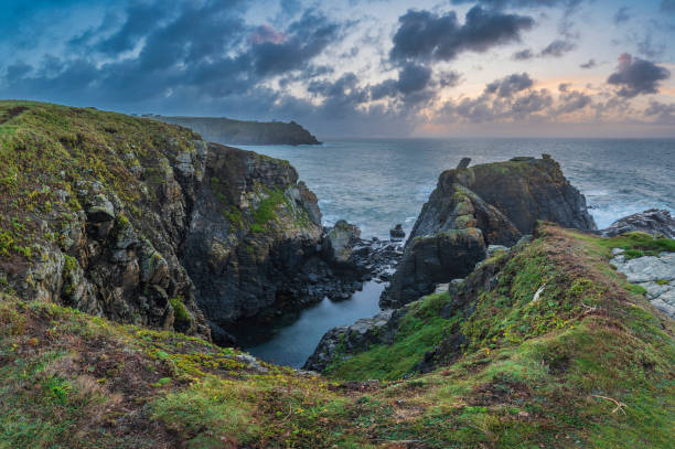 istock Beautiful dramatic Summer dawn over Lizard Point in Cornwall UK with lovely glowing sky and clouds 1739313890