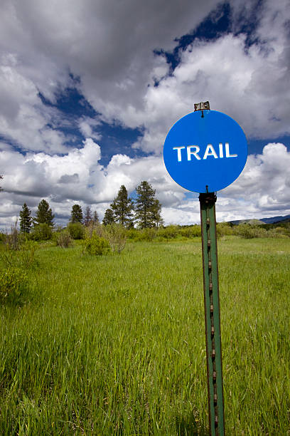 Trail marker with beautiful sky in background. stock photo