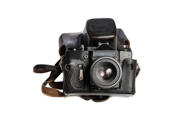 istock Old film SLR camera in a worn leather case on a white background close-up, angled view, floating focus, slight noise 1739316822
