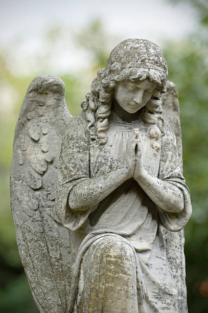 istock Gravestone statue of an angel praying  173932950