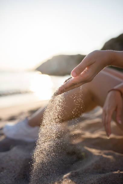 istock Hands playing with sand stock photo 1739329971