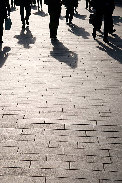 istock Commuters and Shadows Pedestrians Walking on Copy Space 173933339