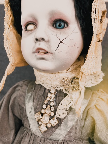 One of my repaints making this doll into a soft spooky doll with vintage costume jewelry and linen clothing.