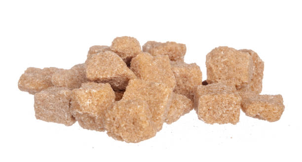 istock Brown cane sugar cubes isolated on white background 1739334602