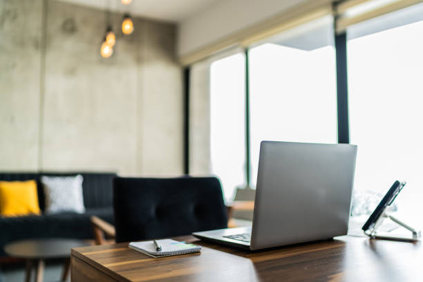 istock Table with laptop on living room 1739337567
