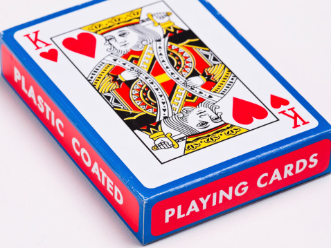 Playing cards on white surface