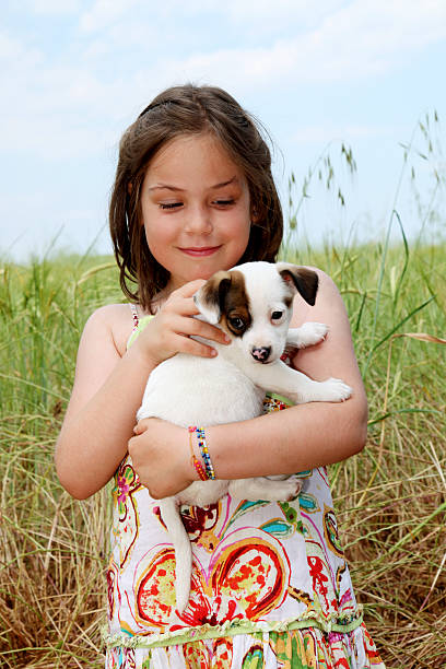 istock Girl and puppy. 173934025