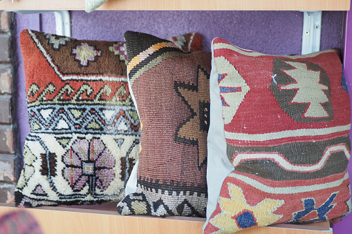 Colourful cushions on display for sale in a traditional Turkish Bazaar