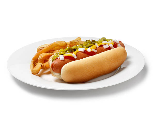 Loaded Hot Dog with Fries "Hot Dog with Ketchup, Mustard, Relish, Onions and French Fries  -Photographed on Hasselblad H3D-39mb Camera" hot dog photos stock pictures, royalty-free photos & images