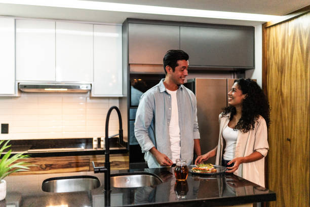 istock Couple talking in the kitchen at home 1739343968