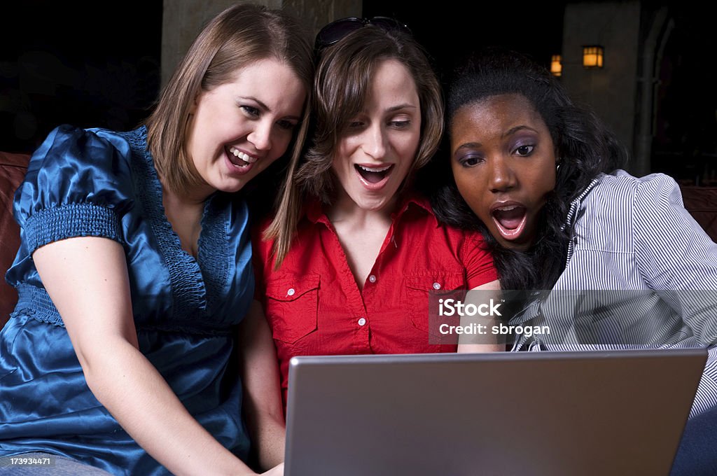 Surprises on the internet Three women gathering at a pub and finding weird and funny things on the internet 20-29 Years Stock Photo
