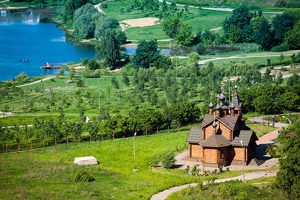 istock Wooden church near river 173934607