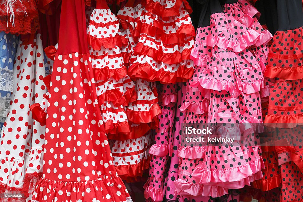 Traditional Spanish Sevillana dresses hanging outside a shop in Cordoba Traditional Andalucian Sevillana dresses.    Andalusia Stock Photo