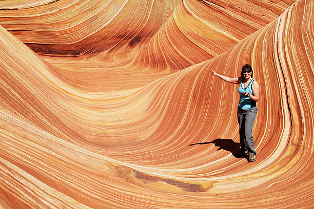 istock Hiking girl with GPS pointing at the Wave 173936495