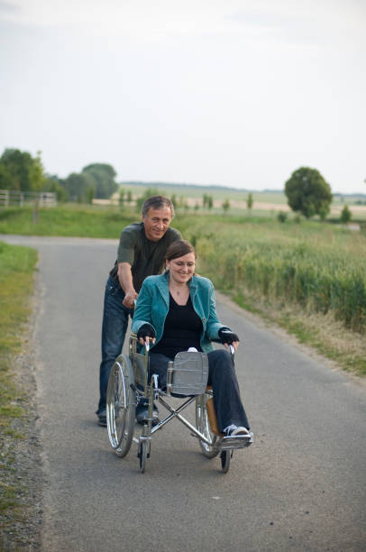 istock Friends with wheelchair 173936601