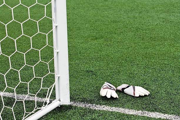 istock Goalkeeper gloves by the net 173937143