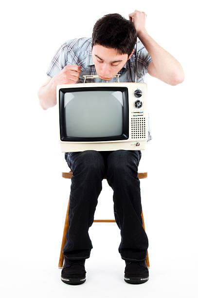 istock young man with old tv 173937557