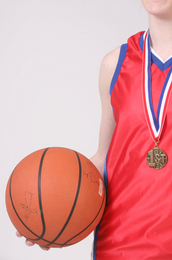 basketball player with a 1st place medal around their neck - a winner