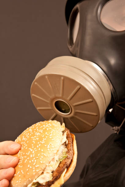 istock Man Wearing Gas Mask With Hamburger 173937851