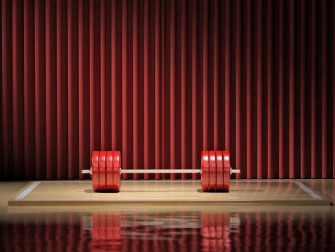 Heavy barbell on a weightlifting stage. Very high resolution 3D render.