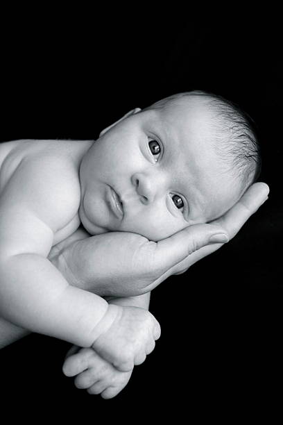 istock Newborn Baby in Mother's Arms 173938310