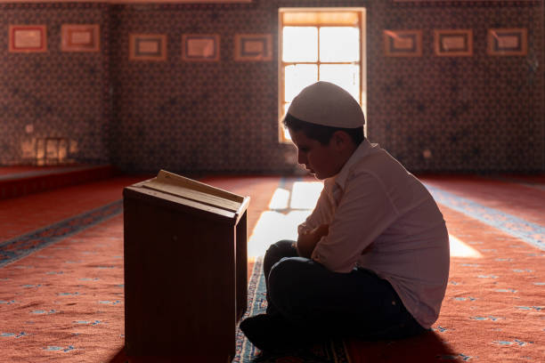 istock A boy reading the Qur'an in a mosque. 1739385642
