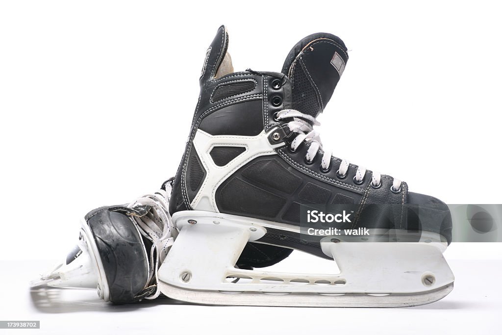 A pair of black and silver ice skates on a white background More ice hockey shots - check my lightbox. Ice Skate Stock Photo
