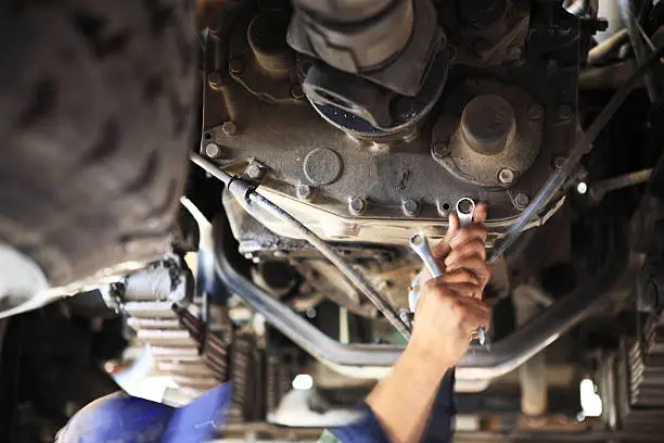 Photo of Motor Mechanic below a Heavy goods Vehicle