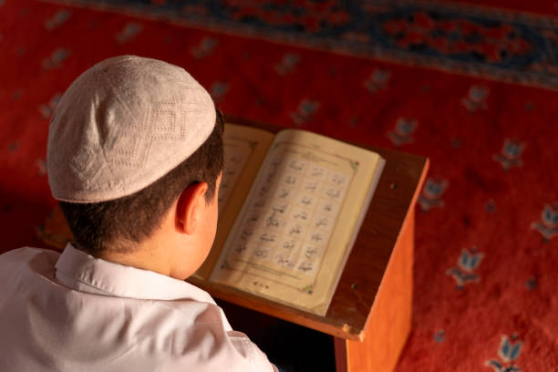 istock A boy reading the Qur'an in a mosque. 1739395236