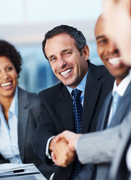 istock Happy business colleagues shaking hands 173939808