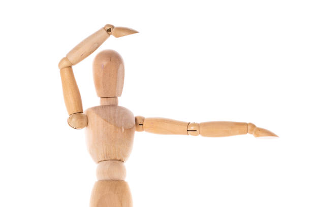 istock A wooden mannequin with its arms extended outward. This versatile image can be used to represent concepts such as creativity, freedom, teamwork, or meditation. 1739402489