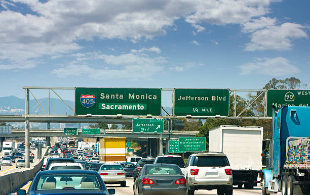 istock Traffic and street signs on an LA freeway 173940478