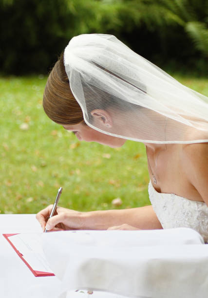 istock Bride signing the marriage contract 173941080