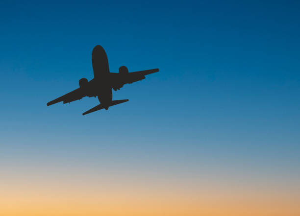 istock Jet aircraft in silhouette against a dramatic sky. Copy space. 1739413722