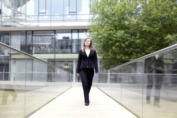 istock Self-Confident Businesswoman walking outdoors on bridge (XXL) 173941875