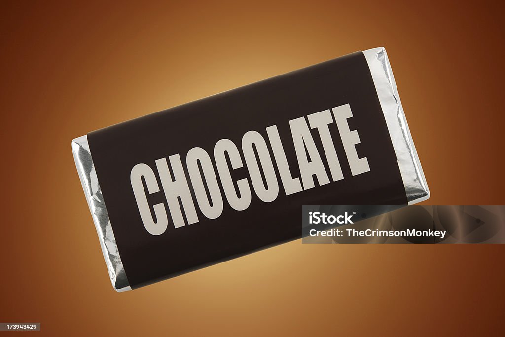 Chocolate Bar Bar of chocolate on cocoa brown background.More fake products: Chocolate Bar Stock Photo