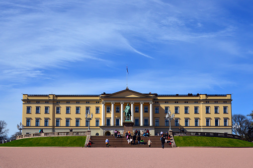 Oslo, Norway: Norwegian Royal Palace - Slottet - the main residence of the King of Norway. It was built from 1825 to 1849 by Charles III John, who reigned as king of Norway and Sweden, designed by the architect Hans Linstow in the classicist style. The building is located at the end of Karl Johans gate, is surrounded by 22 hectares of gardens. It serves as the king's residence, a place of state representation, the administration of the monarchy and also the most elegant guest house in the country. The building is a three-wing complex made of plastered brick. The Karl Johan monument is an equestrian statue by Brynjulf ​​Bergslien, in 1875.