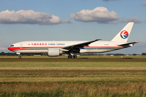Vijfhuizen, Netherlands - June 16, 2015: China Cargo Boeing 777F with registration B-2079 on take off roll on runway 36L of Amsterdam Airport Schiphol.