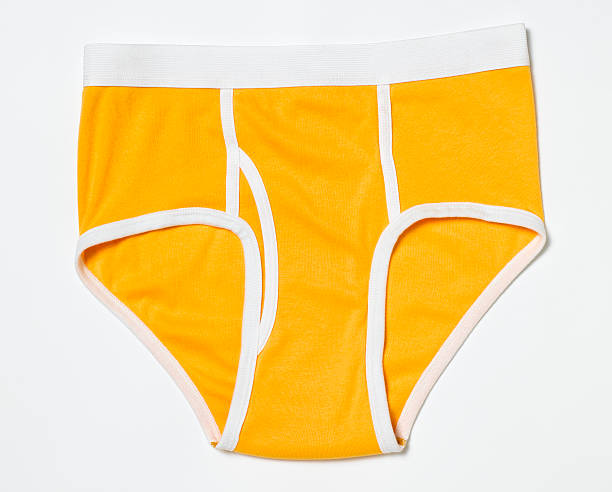 A pair of male orange underwear briefs stock photo