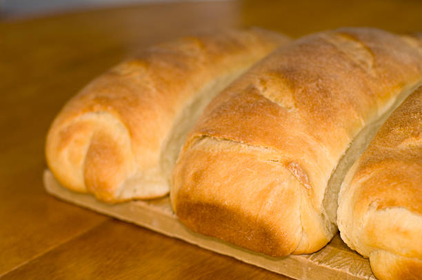 istock 3 Loaves of Bread on a Cutting Board 173944807