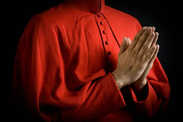 Bishops hands clasped together.Note: Costumes are not copyrighted as they are all custom made. All insignias and buttons are generic.