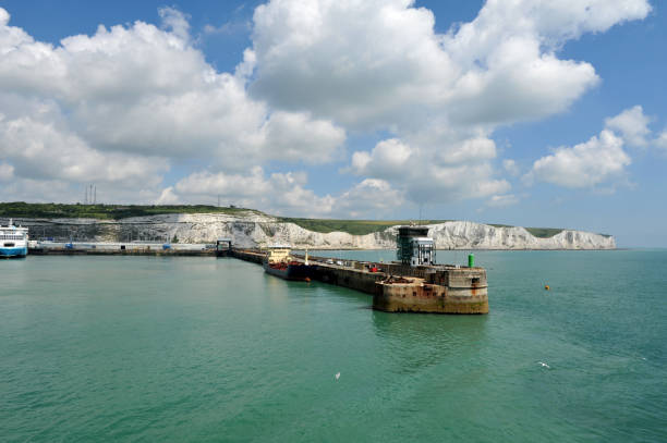 Image of the entrance to the eastern docks of Dover harbour.  The White Cliffs of Dover provide a stunning backdrop to the harbour and English Channel.