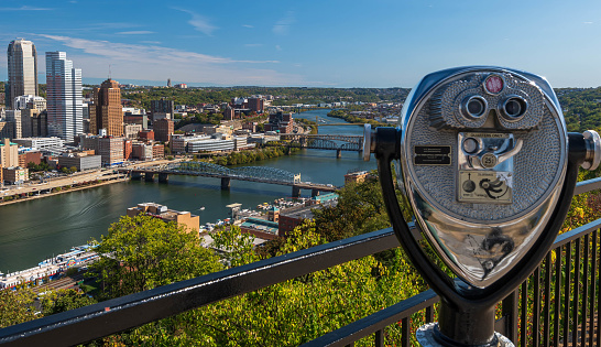 Pittsburgh, Pennsylvania, USA October 13, 2023 A tower viewer on Grandview Avenue overlooking downtown and the bridges spanning the Monongahela River on a sunny fall day