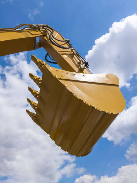 istock earth digger machine's scoop lifted 1739461312