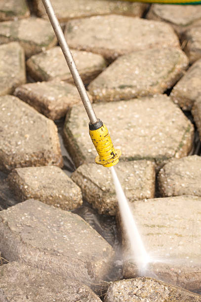 istock pressure washing walkway stones 173946144