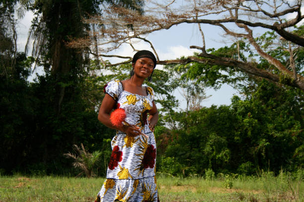 African american woman smiling on camera outdoor at city park - Focus on face