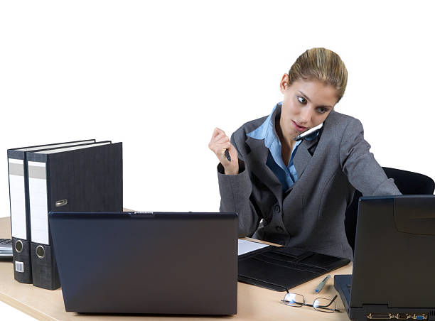 Computer work, office scene Young business woman working at a laptop computer, isolated on white background ... http://istock.sk-websolutions.at/img/istock-banner-jr11.jpg jacraa2007 stock pictures, royalty-free photos & images