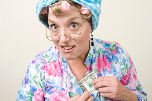 Crazy old lady in night gown with hair curlers pulling a dollar bill from her cleavage.